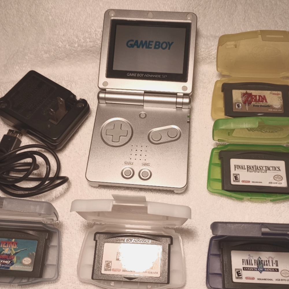 Nintendo Game Boy Advance DS Platinum with 5 games and charging cord, free gift